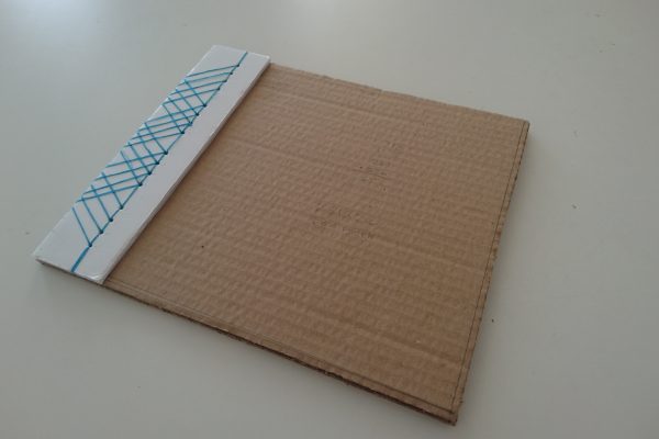 The binding mockup placed where it will be on the final brochure.